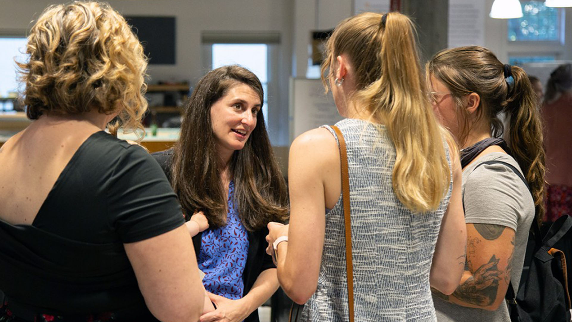 Andrea Ippolito ’06, M.Eng ’07, founder of Simplifed, networks with members of the entrepreneurship community at a June 2024 networking event at Rev: Ithaca Startup Works.